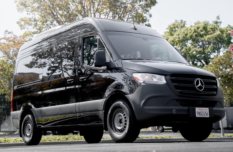 A black Mercedes-Benz Sprinter van